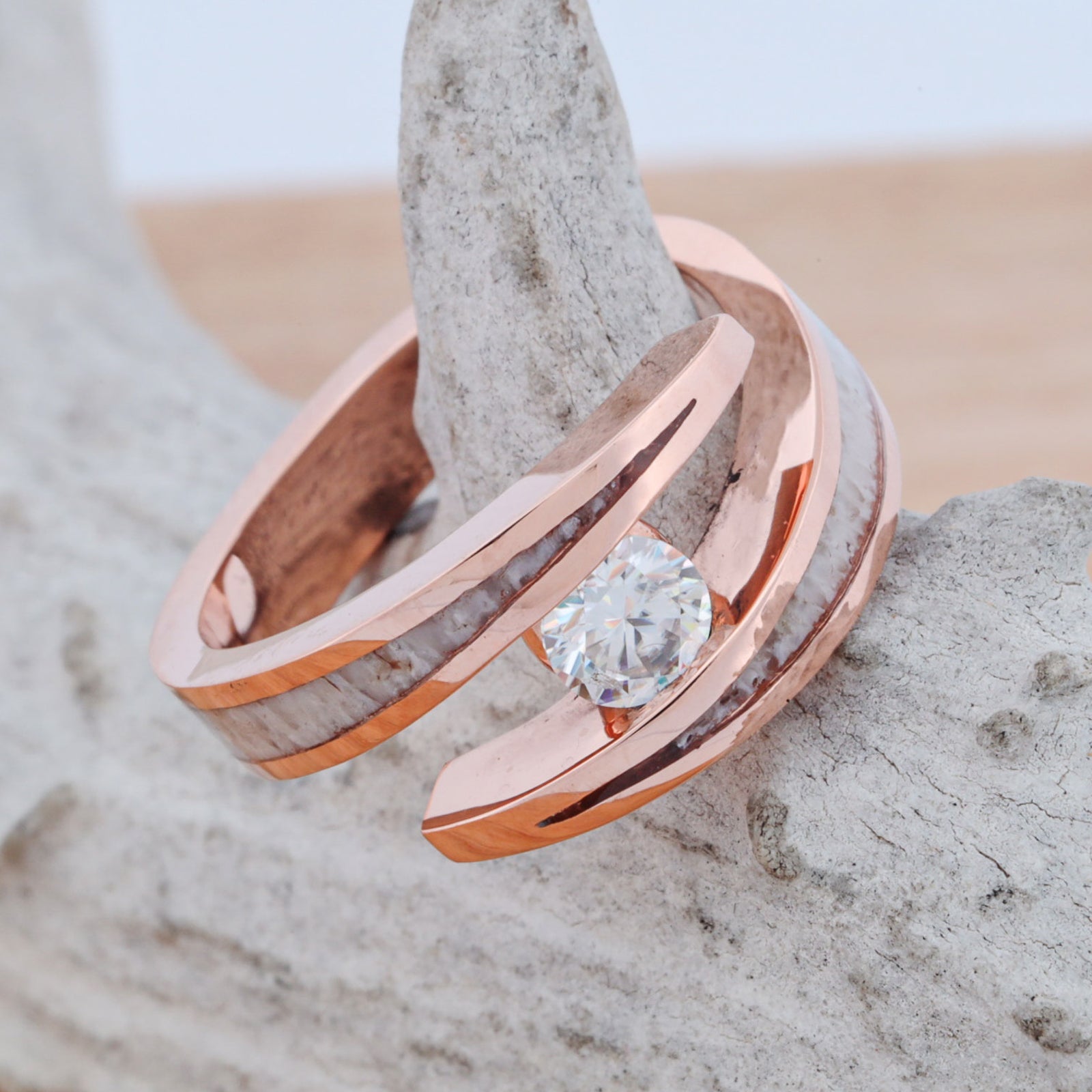 Hand-forged Stone Forge ring with rose gold, antler and a tension-set diamond