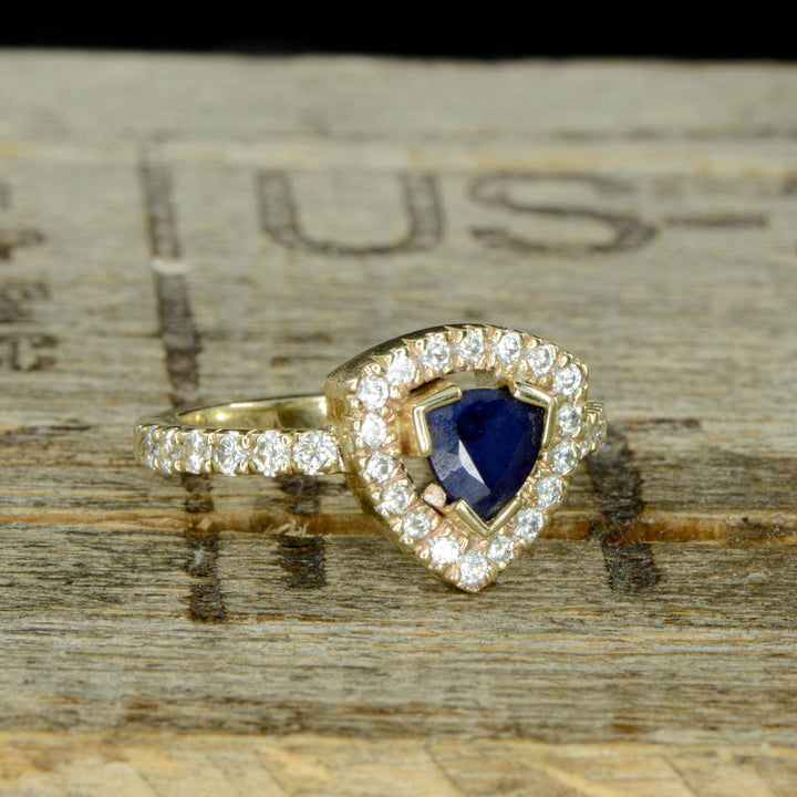 Sapphire Trillion Halo Ring with Diamond Accents