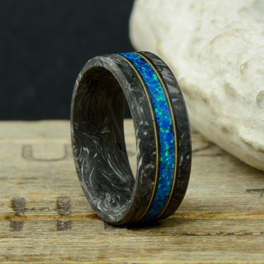 The Cithern - Forged Carbon Fiber Ring with Blue Opal and Guitar Strings